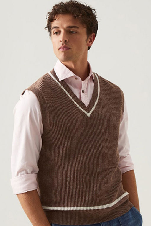 a-model-in-pink-shirt-and-brown-sweater-vest
